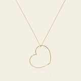 Long necklace with large hollow-tube heart pendant