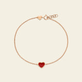 Gold bracelet with red enamel heart