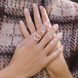 Gold and diamond band ring with hearts