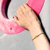 Cord bracalet with flat gold paw