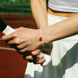 Cord bracelet with red enamel heart